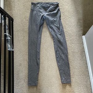 Gray lululemon wunder under athletic tights.